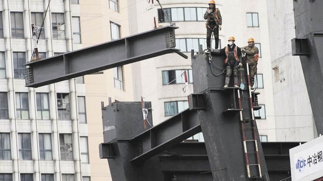 CONTAGIO. La crisis del sector inmobiliario chino obliga al Gobierno a actuar y provoca efectos perniciosos sobre el resto de la economía.