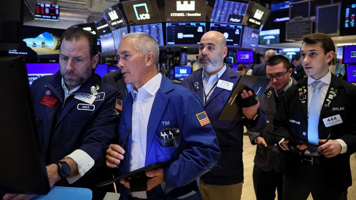 Wall Street closed lower despite the S&P 500 hitting a new record