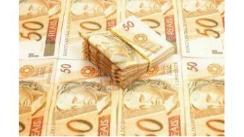Leve depreciación del real a 2,997 por dólar