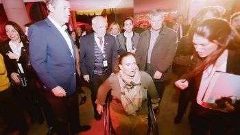 Inauguración. Enrique Cristofani, Oscar Correa, junto a Gabriela Michetti en el estreno de la nueva sede del Banco Santander